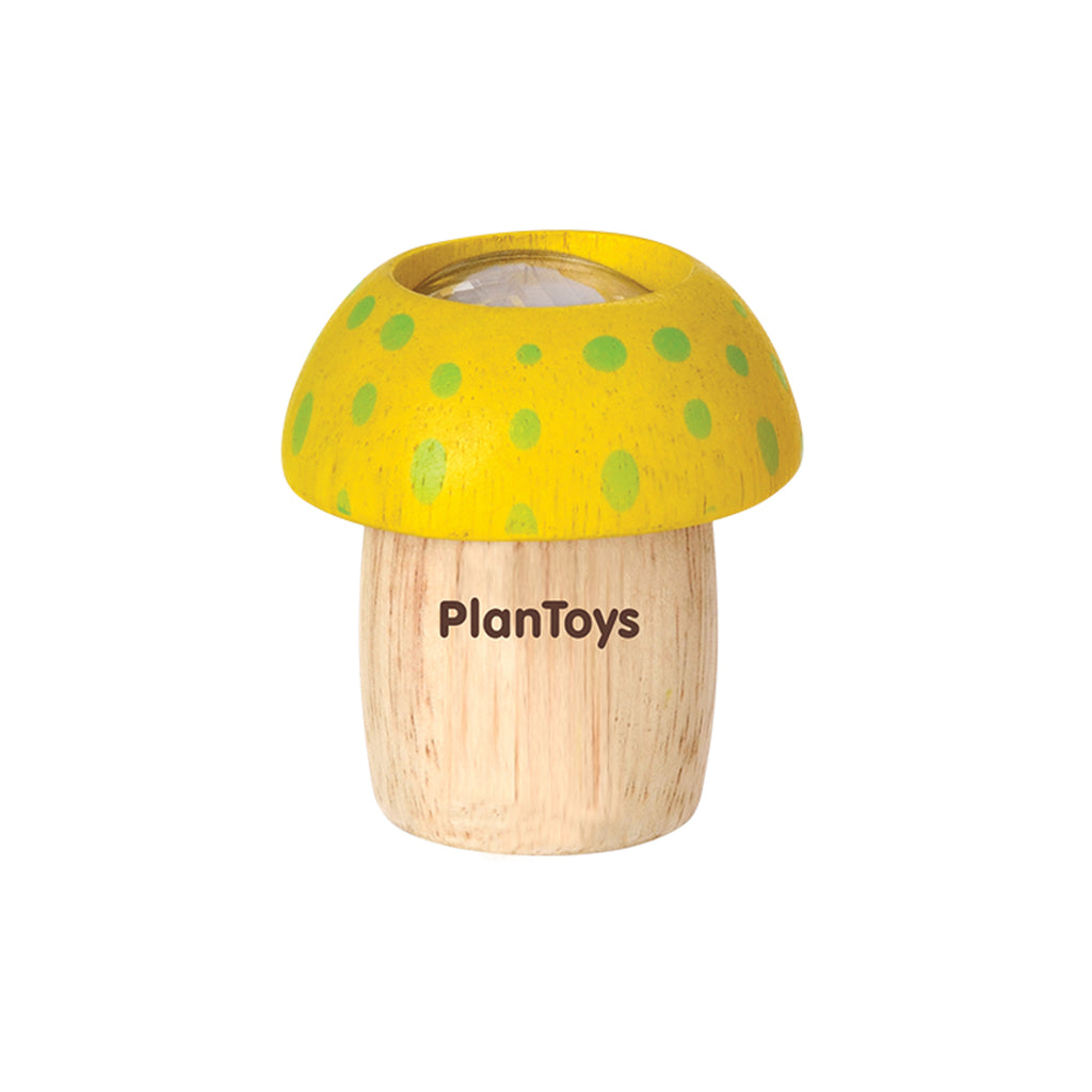 Wooden toy shaped like a Mushroom Kaleidoscope with a yellow cap dotted with green spots, standing on a natural wood base with the brand "PlanToys" printed on it, designed to explore creative thinking skills.