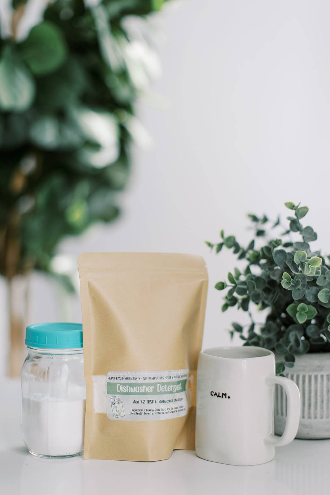 Eco-friendly dishwasher detergent bag with mug and plant