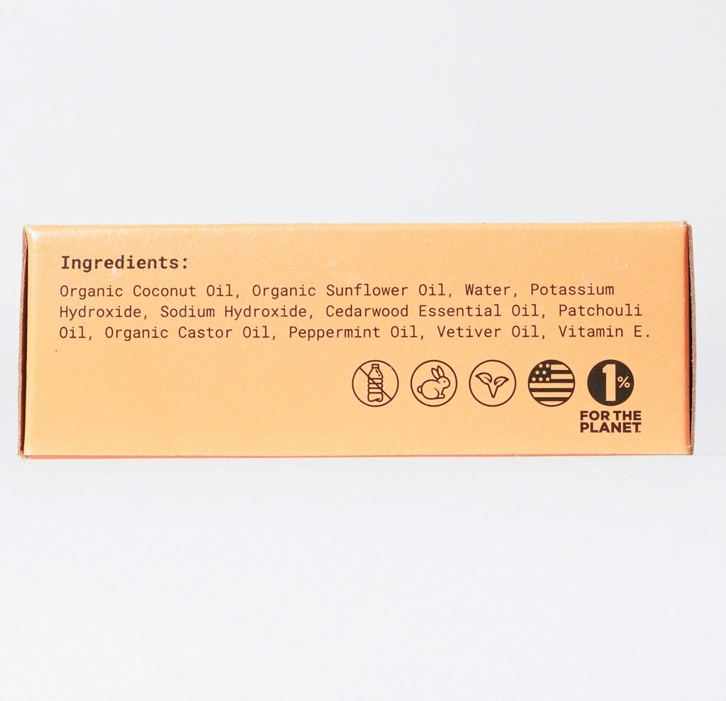 A cardboard box displaying a list of organic ingredients and certifications, indicating it contains Canary Clean Products - Cedar Mint Concentrated Hand Soap Refill Bars made with natural oils, is plastic-free, and is associated with the "1% for the planet".