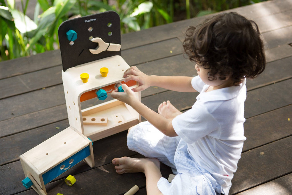 Wooden Workbench with kid playing zoomed out 