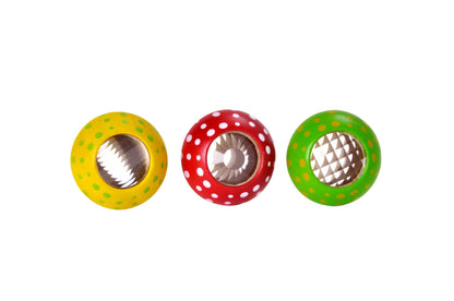 Three colorful PlanToys Mushroom Kaleidoscope maracas with dot patterns isolated on a white background.