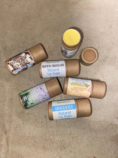 Variety of natural lip balms on the ground 