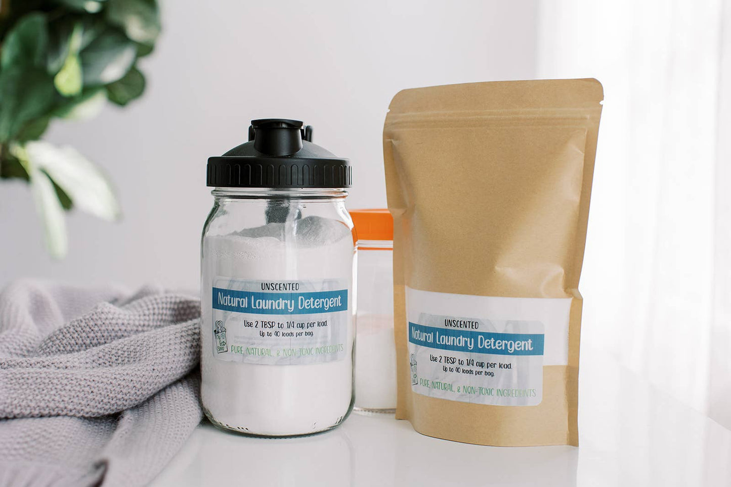 Natural laundry detergent in bag and jar, unscented